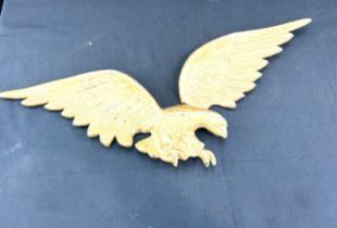 Cast iron wall hanging eagle measures approx 24 inches wide by 9 inches tall