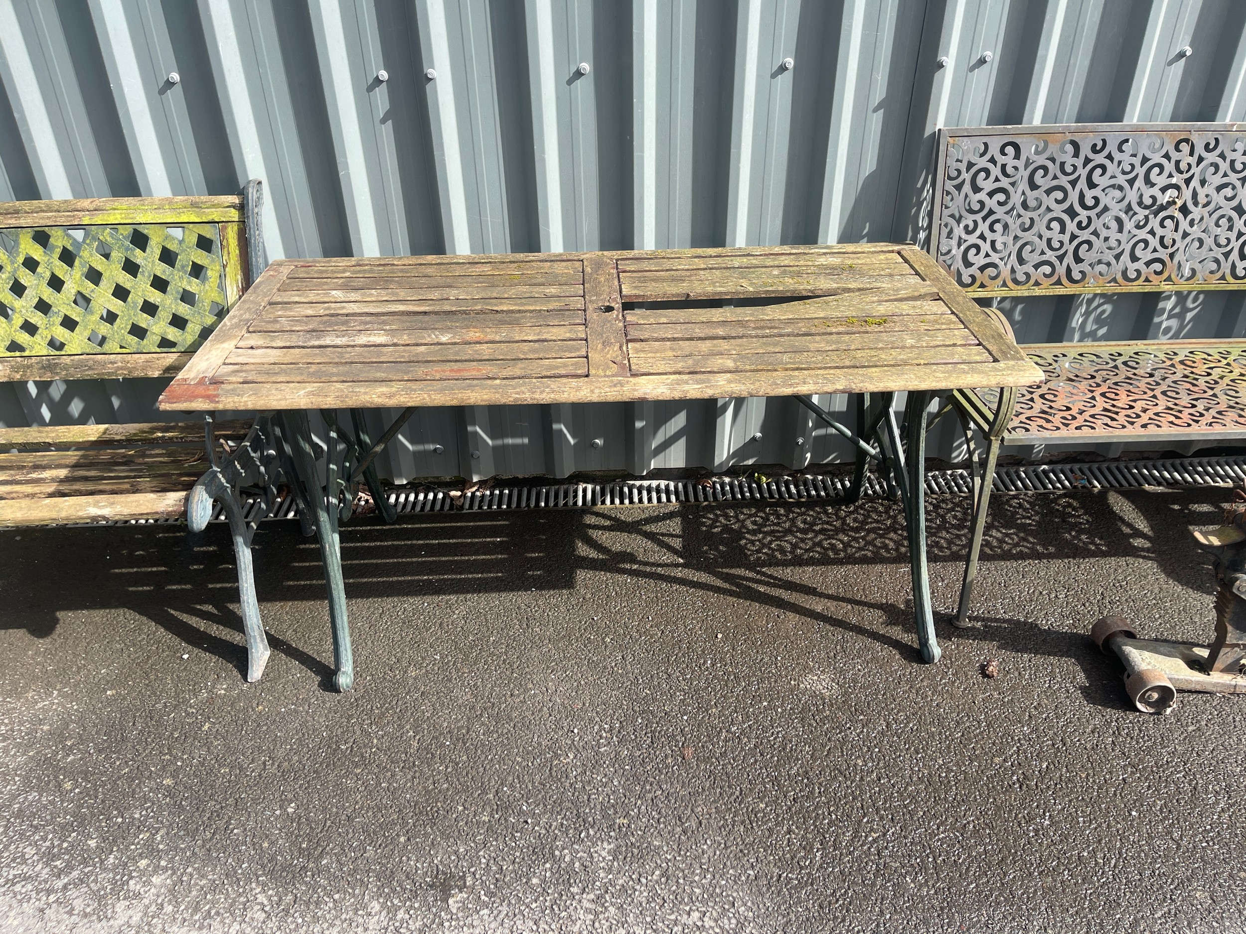Vintage cast iron base garden table measures approximately