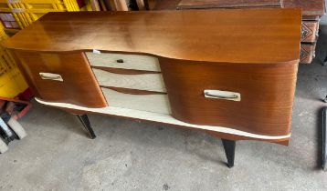Three door two drawer Stone hill teak side board measures approx 30.5 inches tall, 17 deep and 59