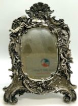 Sterling silver overlay cherub small mirror, approximate measurements: 25 x 18.cm (widest point)