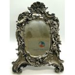 Sterling silver overlay cherub small mirror, approximate measurements: 25 x 18.cm (widest point)