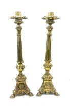 Pair of vintage brass candle sticks overall height approx 26 inches