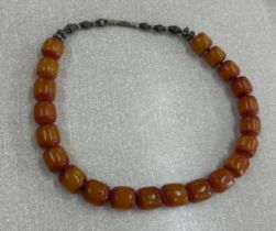 Row of old amber beads length 19"