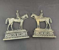 Pair of cast iron door stops approx measurements 8 inches long