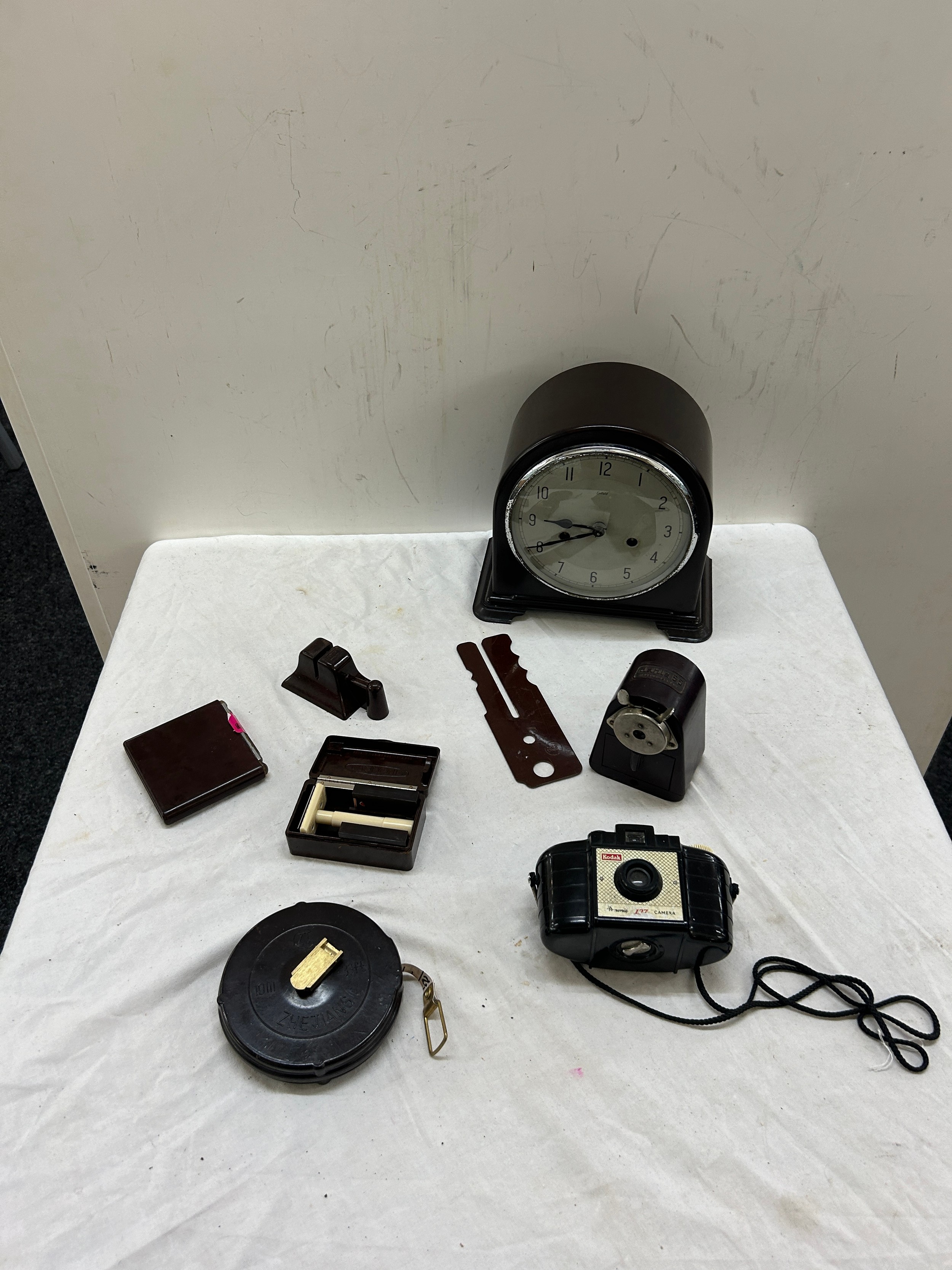 Selection of Bakelite items includes camera, clock etc