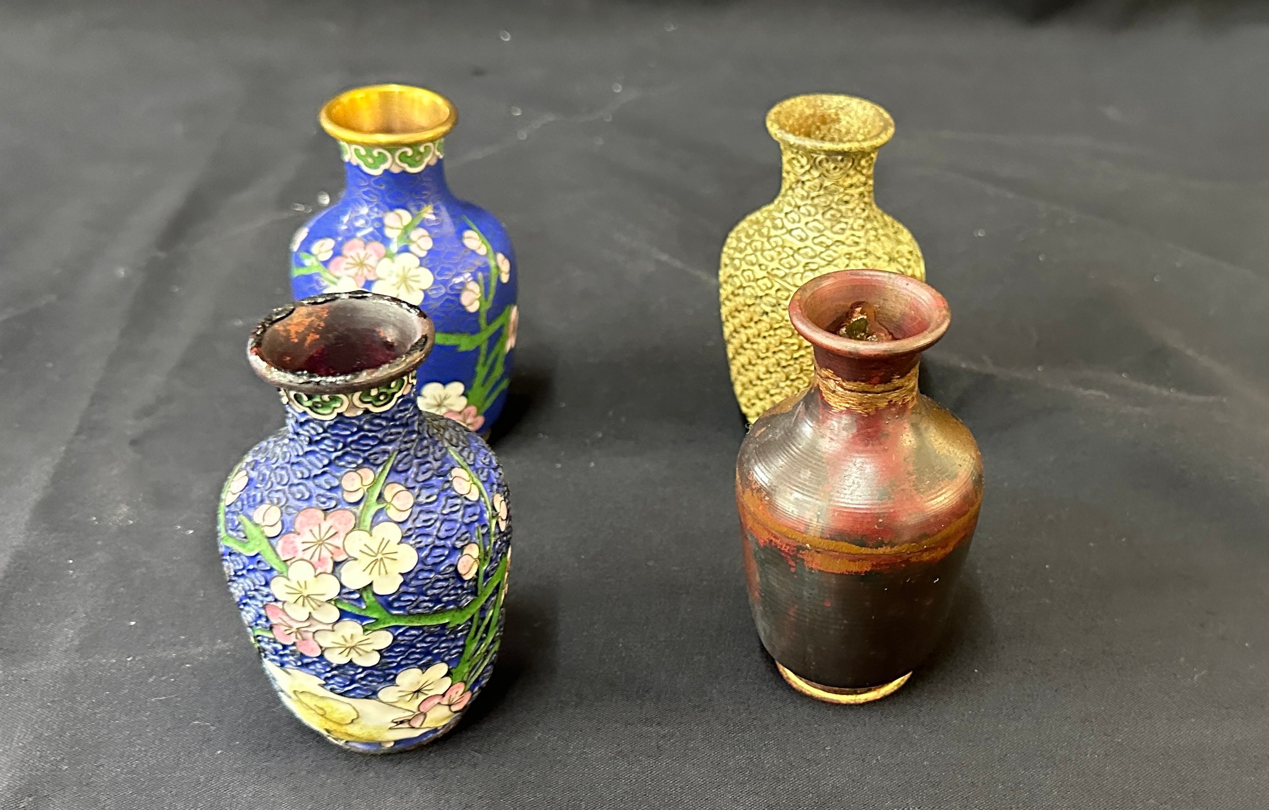 Set of four Cloisonné vases showing the four stages of production 4" high.