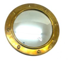 Brass framed ship style mirror measures approx 16 inches wide