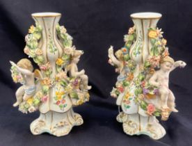 Pair Meissen style cherub candle sticks, height 9 inches, width 6 inches