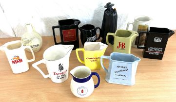 A lot of 12 x pub advertising water jugs