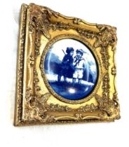 Gilt framed blue and white wall plaque, approximate frame measurements 12 x 12 inches