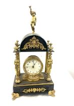 Vintage brass and metal clock with key measures approx 18 inches tall by 9 inches wide