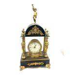 Vintage brass and metal clock with key measures approx 18 inches tall by 9 inches wide