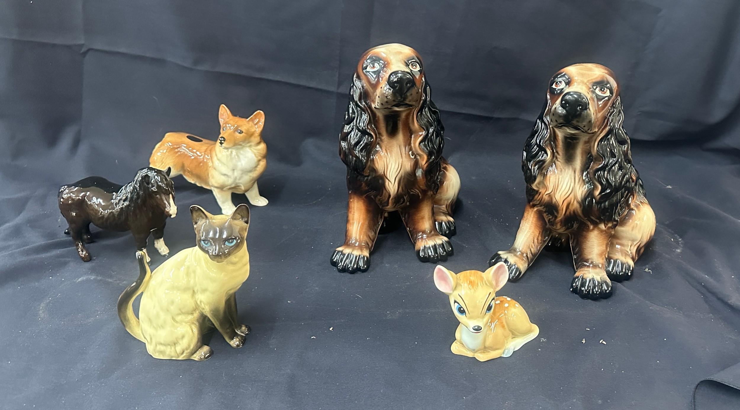 Selection of porcelain animal figures, dogs, cats, wade Disney Bambi etc