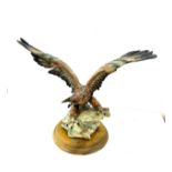 Giuseppe Armani Capodimonte golden eagle figurine measures approximately 12 inches by 15 inches