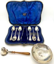 Cased set of hallmarked silver teaspoons and sugar tongs together with a hallmarked silver candle