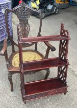 Three pieces of mahogany items to include a bergere seated carver chair, bookcase and a wine table