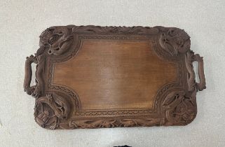 Carved Indonesian tray measures approximately 15 x 26 inches