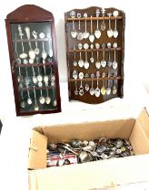 Large selection of assorted souvinere spoons, with 2 display cases