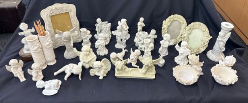 Large selection of Cherub figures includes candle sticks, photo framed etc