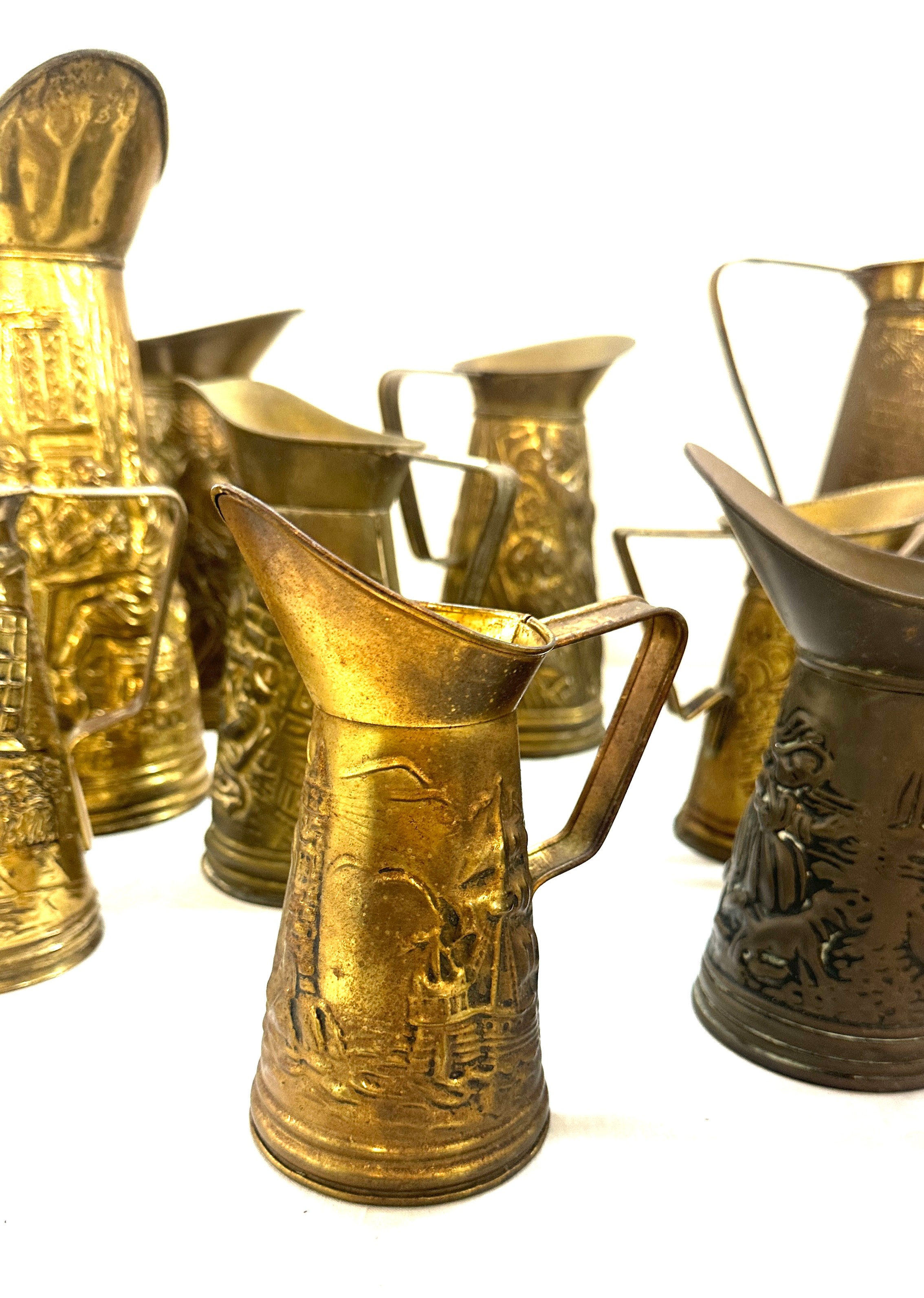 Selection embossed brass jugs, various heights - Image 5 of 6