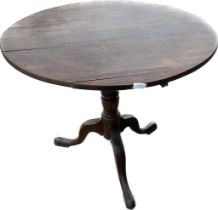 Antique three legged tilt top table measures approx 28 inches tall by 31 inches diameter