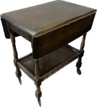 Oak drop leaf tea trolley made by Priory furniture with drawer measures approx 30 inches tall, 28
