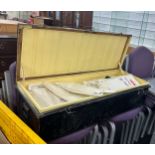 Vintage metal travel trunk with a large selection of assorted vintage and later shirts