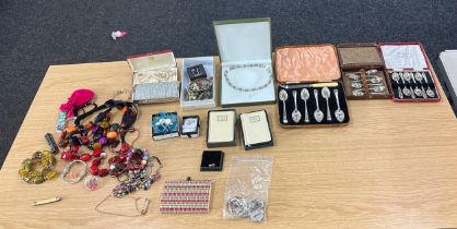 Large selection of assorted costume jewellery includes necklaces, cutlery etc
