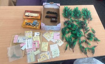 Selection of train track accessories and boxed trucks