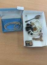 Selection of pearl necklaces costume jewellery and a silver spoon