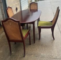 Mahogany table and four chairs with bergere chairs
