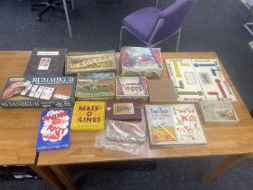 Box of old games from victorian era through to 1980s includes Croquet, die cut tin footballer, board