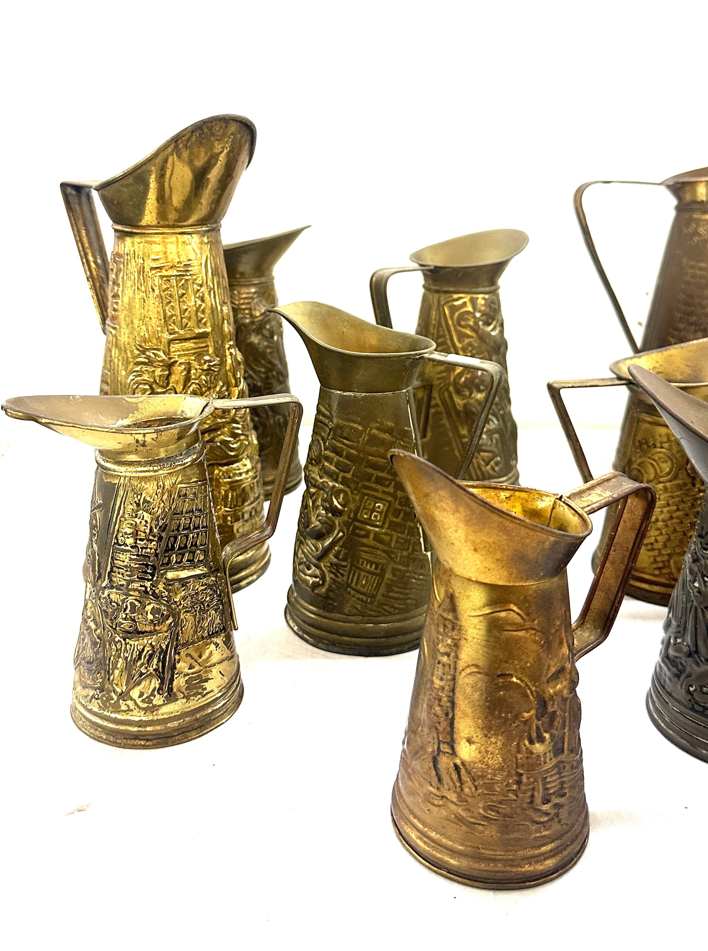 Selection embossed brass jugs, various heights - Image 6 of 6