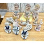 Large selection of assorted Baby figures includes Piano babies etc