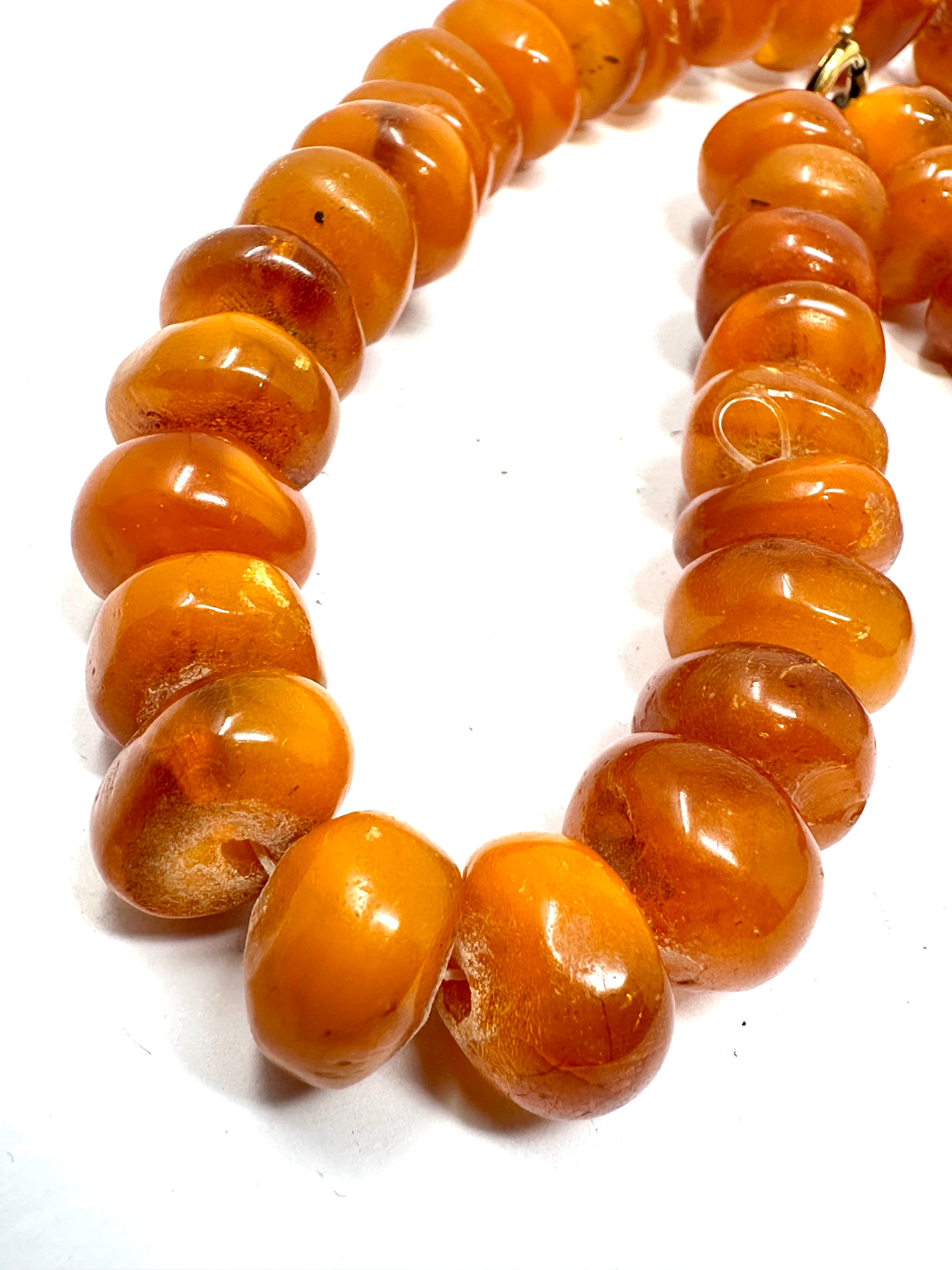 Egg yolk amber bead necklace weight 65g - Image 4 of 5