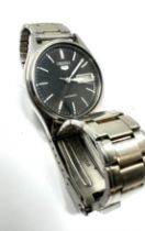Vintage Seiko 5 Automatic Day & Date 7009 -3100 the watch is ticking black dial