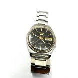 Vintage Seiko 5 Automatic Day & Date 7009 -3140 the watch is ticking black dial