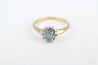 9ct gold oval cut blue topaz & diamond cluster ring, claw set