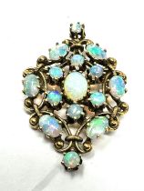 fine 14ct gold opal pendant /brooch measures approx 4cm by 2.7cm weight 8.2g