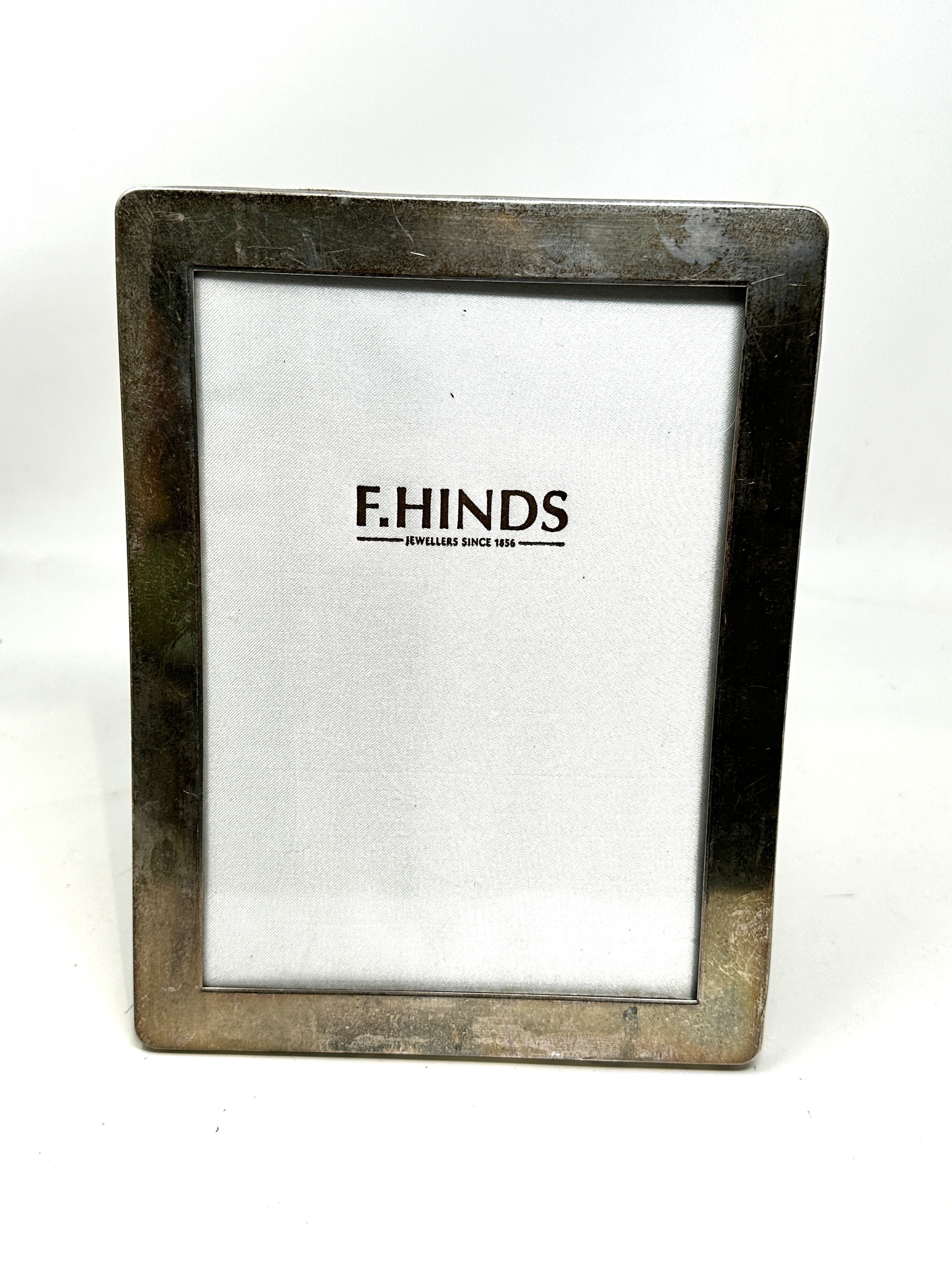 Silver picture frame measures approx 21.5cm by 16cm