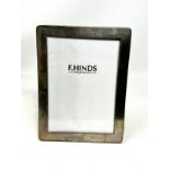 Silver picture frame measures approx 21.5cm by 16cm