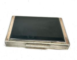 Art deco silver & gold detail with black onyx lid snuff box measures approx 8cm by 5.5 cm silver