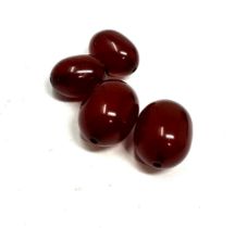 2 pairs of matching size cherry bakelite beads both pairs have internal streaking would make great