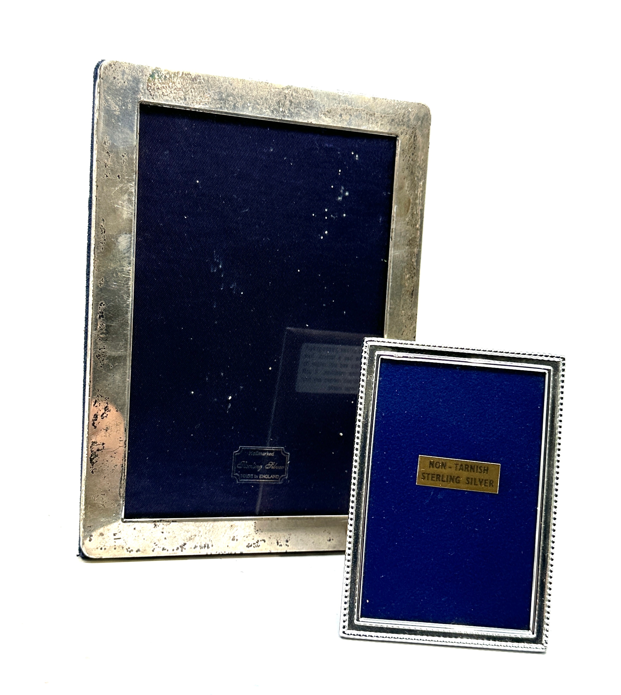 2 silver picture frames largest measures approx 18cm by 13cm