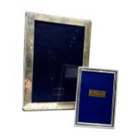 2 silver picture frames largest measures approx 18cm by 13cm