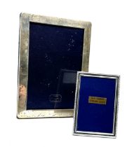 2 silver picture frames largest measures approx 18cm by 13cm