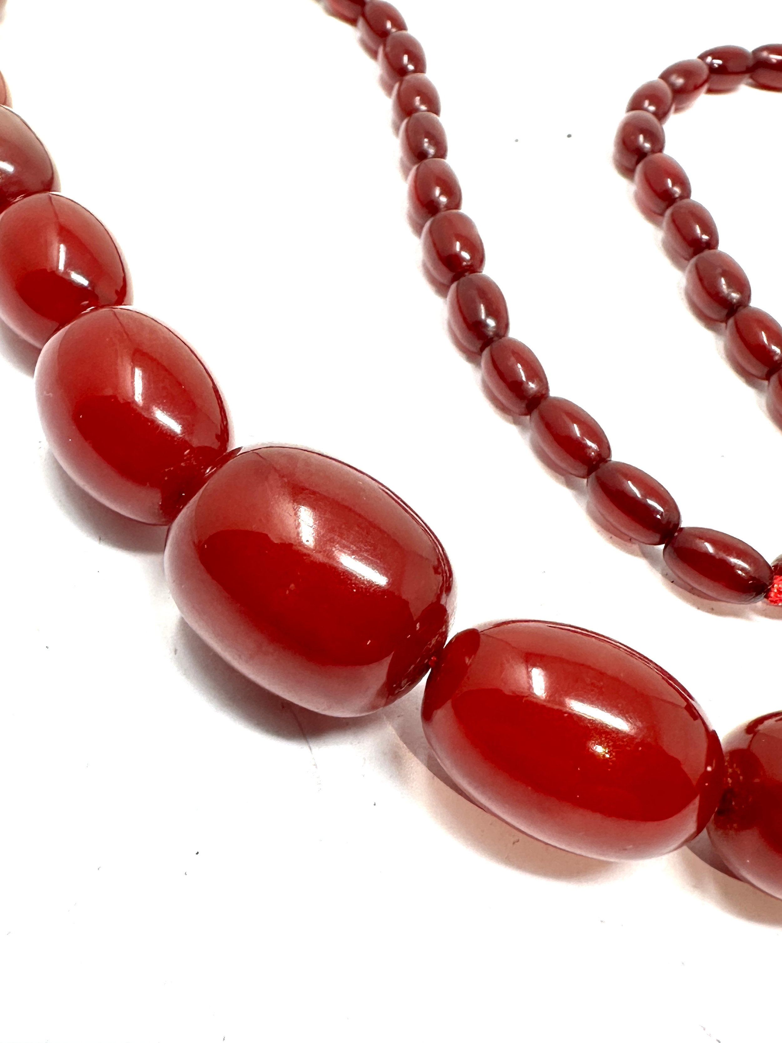 Antique cherry amber / bakelite bead necklace weight 63g good internal streaking - Image 2 of 3