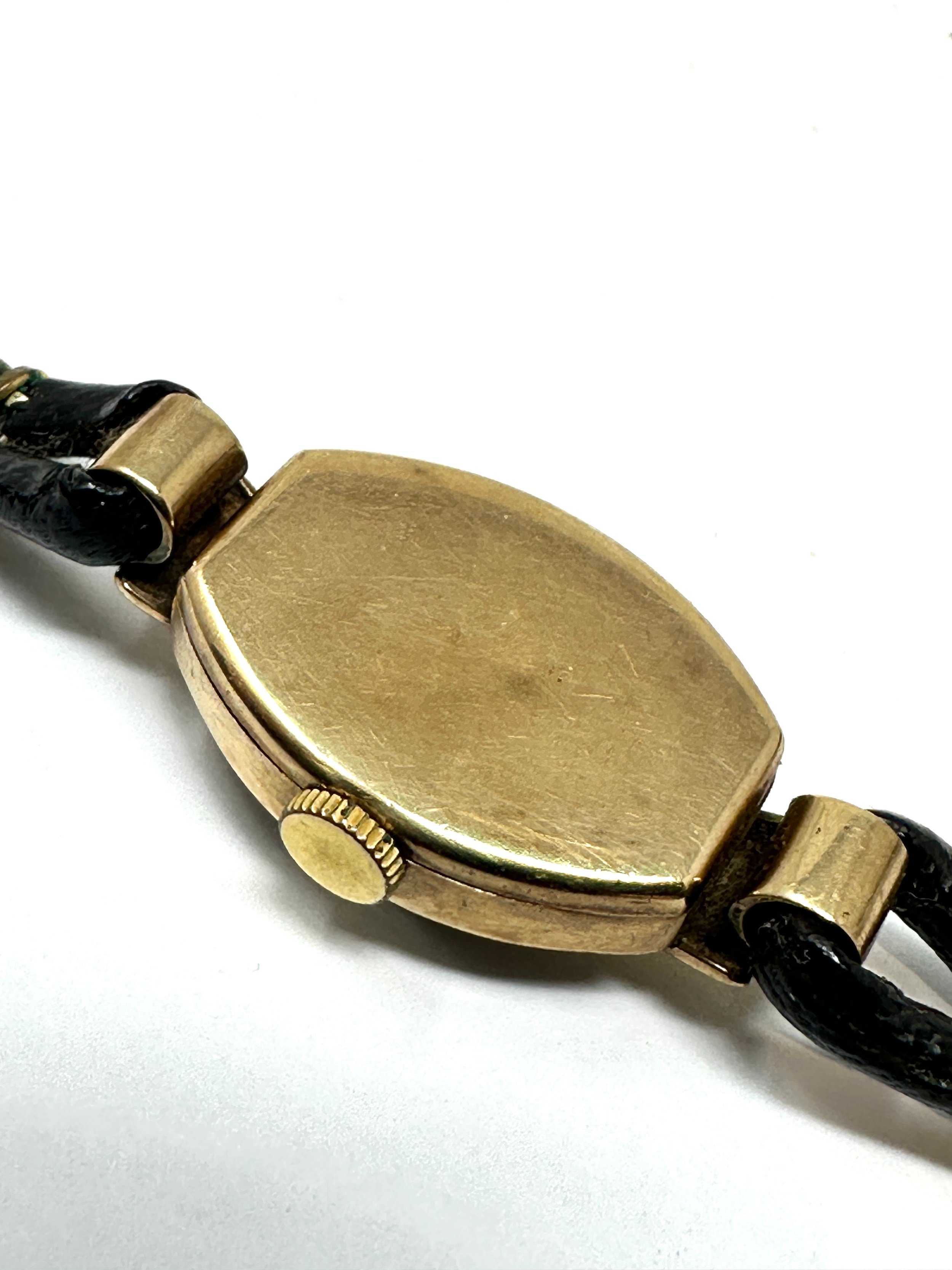 Vintage 9ct gold ladies rolex tudor wristwatch with black leather strap the watch winds and ticks - Image 3 of 4