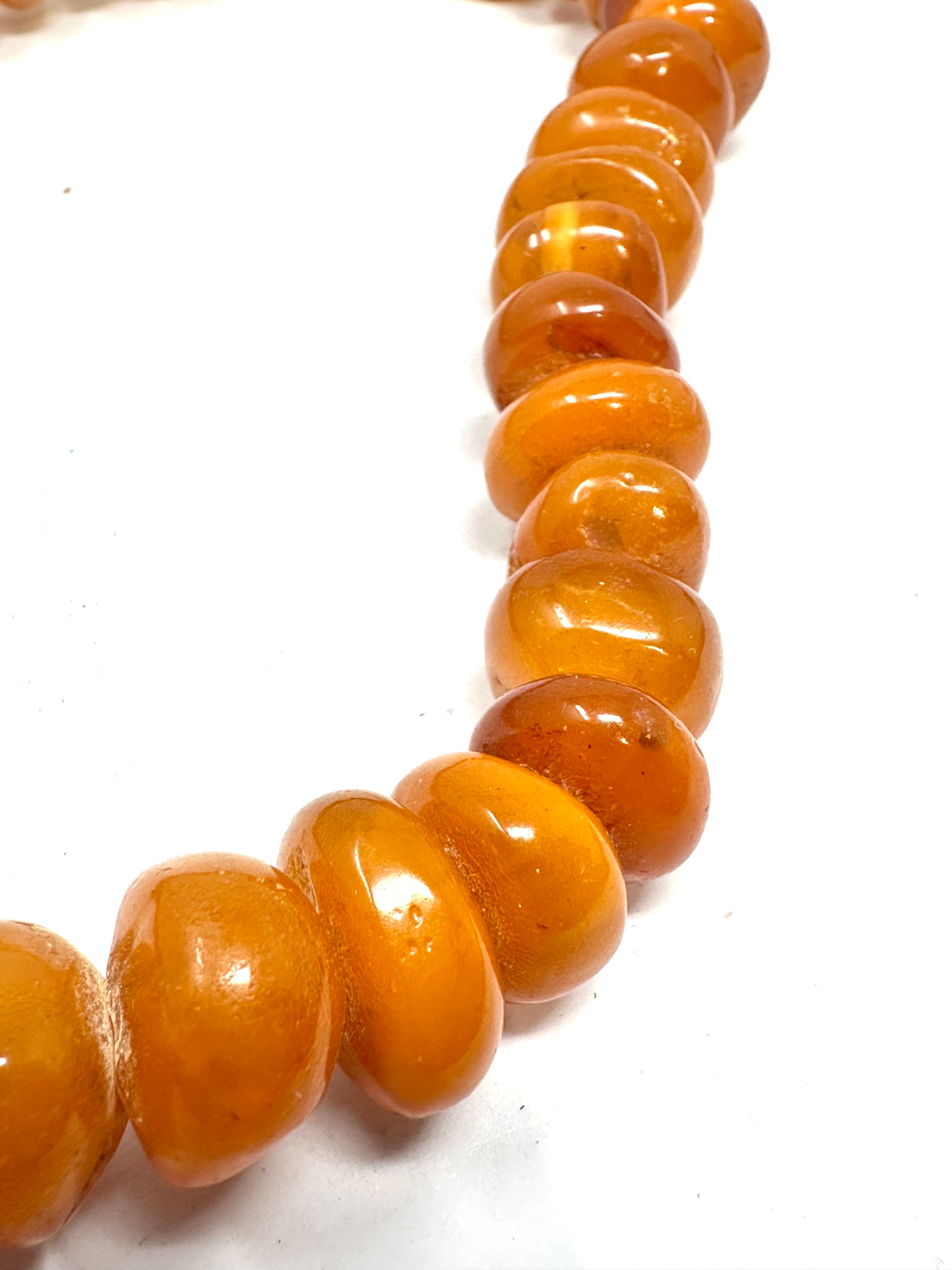 Egg yolk amber bead necklace weight 65g - Image 2 of 5