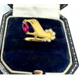 18ct gold hand ring set with red & white gemstones weight 2.9g has been xrt tested as 18ct gold